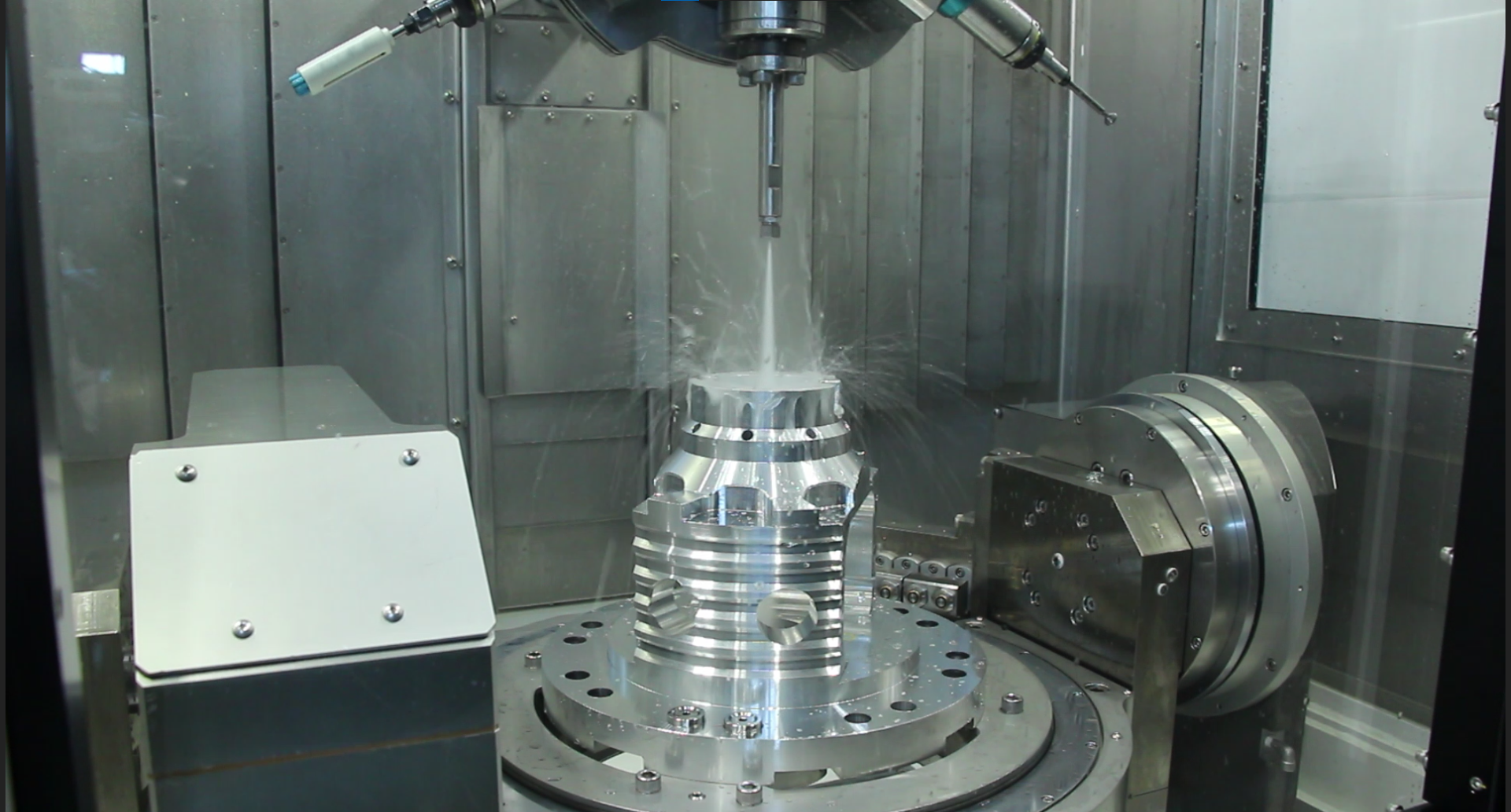 Sugino's powerful high pressure water jet deburring removes chips and burrs from blinid holes, tapped holes, and cross holes